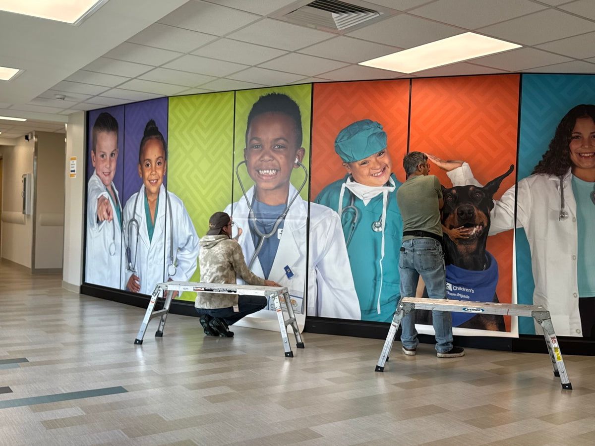 A large wall mural installed by DG Creativ using vinyl graphics on a glass wall at Akron Children's facility in Boardman, OH