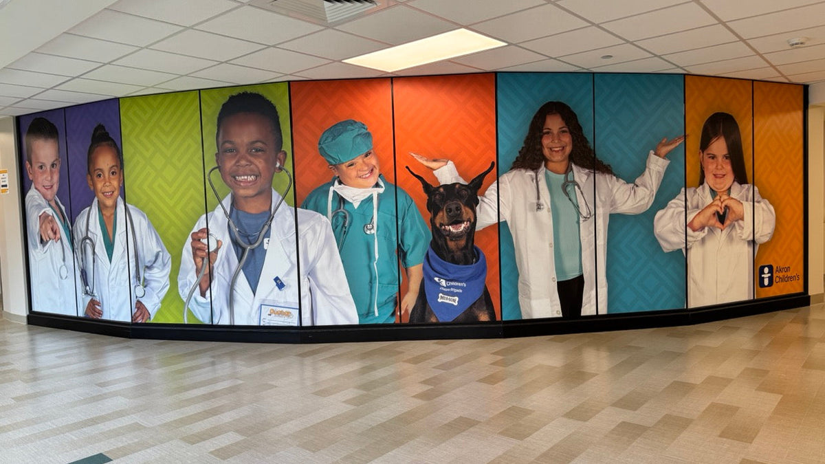 A large wall mural installed by DG Creativ using vinyl graphics on a glass wall at Akron Children's facility in Boardman, OH