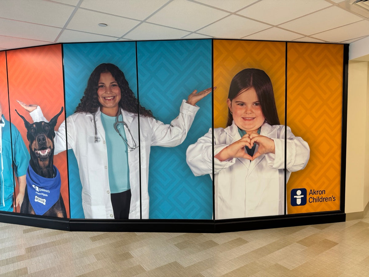A large wall mural installed by DG Creativ using vinyl graphics on a glass wall at Akron Children's facility in Boardman, OH