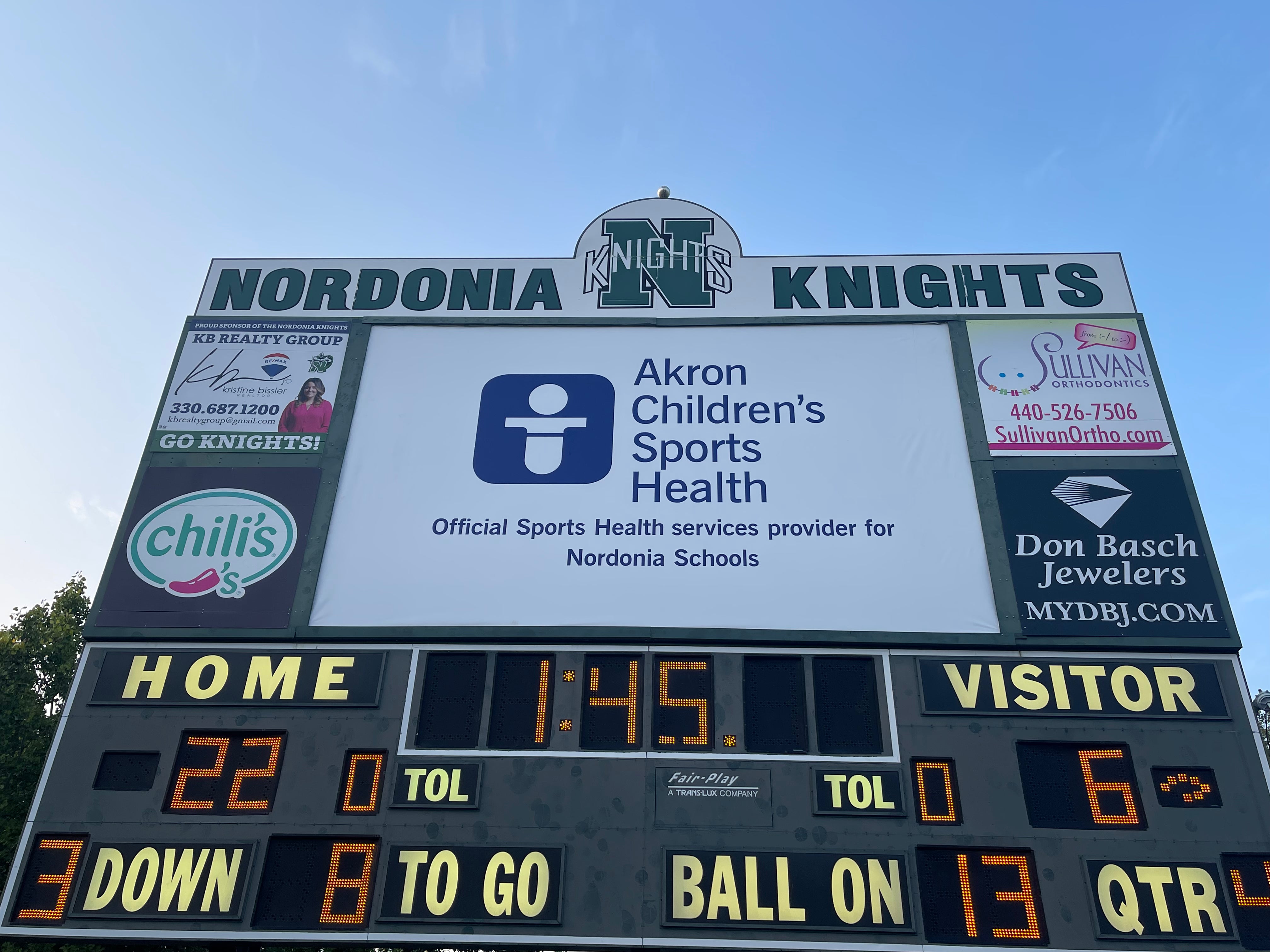 New 13 oz Banner iCompleted of installation on massive backlit scoreboard
