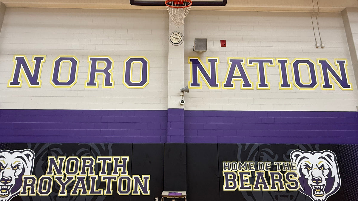 Precision CNC cut large-scale dimensional letters for high school gymnasium branding