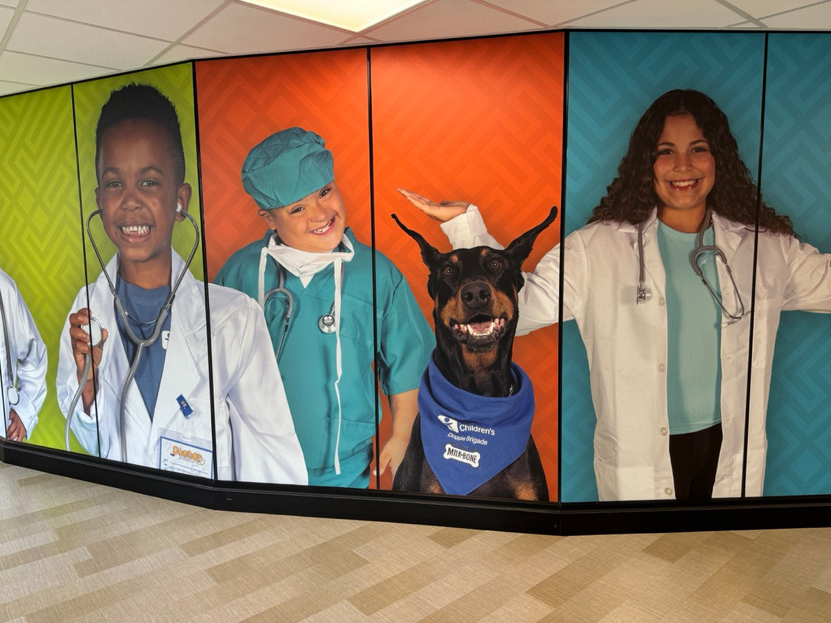 A large wall mural installed by DG Creativ using vinyl graphics on a glass wall at Akron Children's facility in Boardman, OH