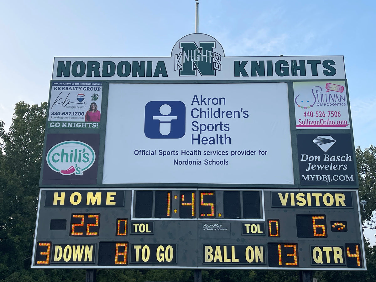 Large format 145-inch tall 13 oz vinyl backlit banner scoreboard graphic retrofit at Nordonia High School.