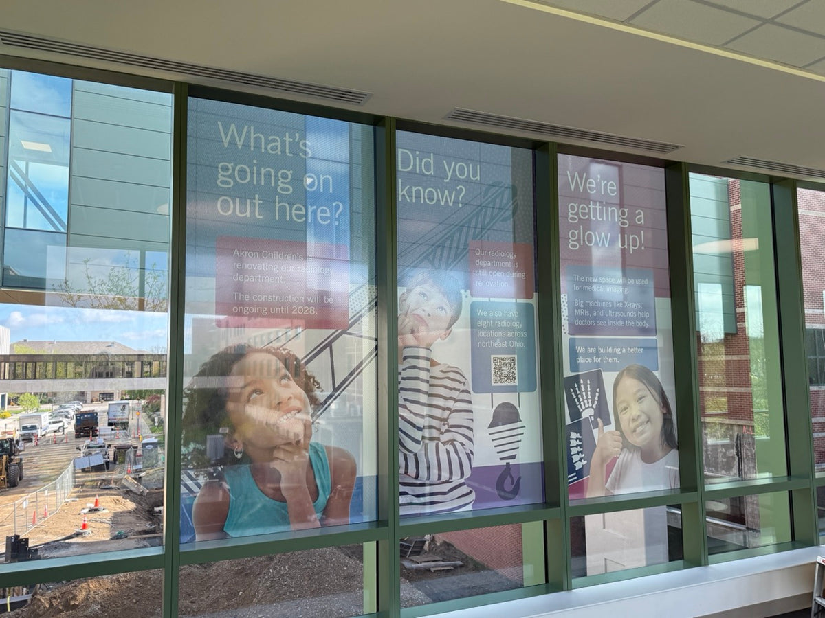 DG Creativ window perf graphics with an optically clear over laminate on one of Akron Children's Hospital pedestrian bridges